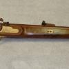 Walnut-Rifle with Oak Inlays and Oak ferrules  holding Ramrod-Moveable  Hammer.  Rifle is 30 inches long.